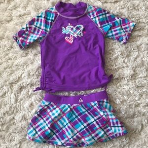 Purple two piece swimsuit with rash guard top